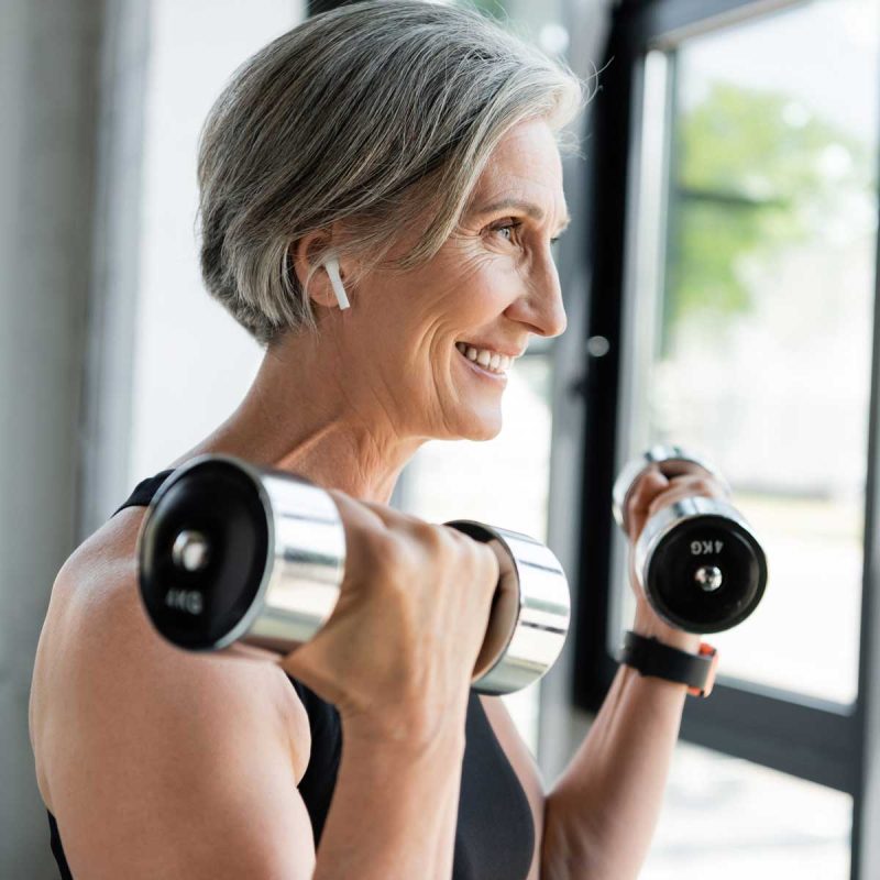 happy-senior-sportswoman-in-wireless-earphone-work-2026-03-25-04-24-21-utc