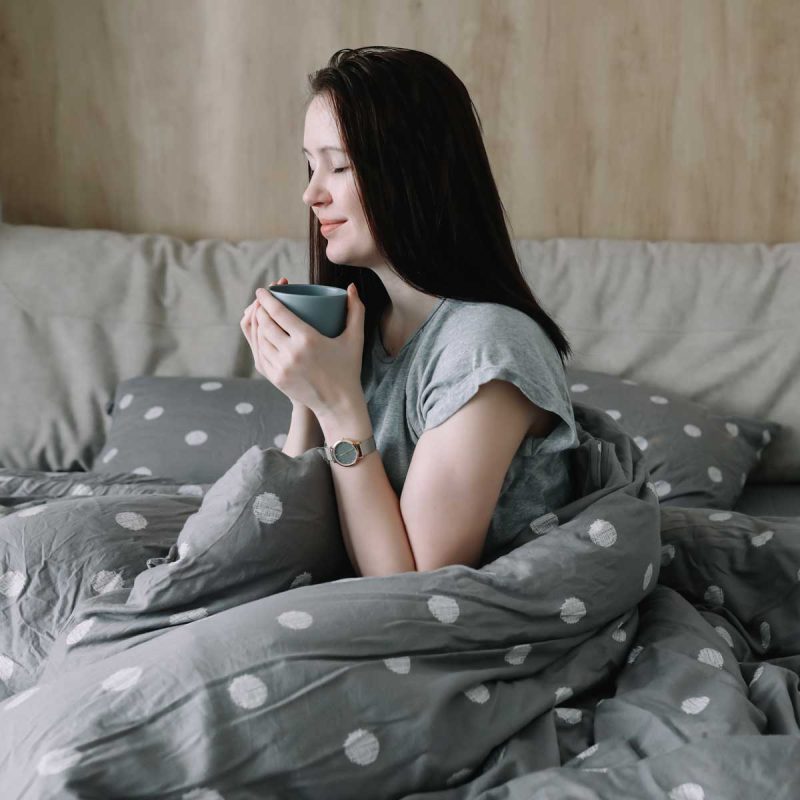 woman-enjoying-coffee-in-bed-on-a-morning-2026-01-06-10-12-13-utc